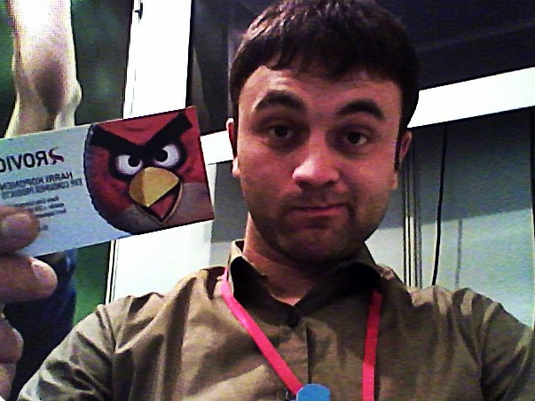 Maxim holding Harri Koponen's Rovio business card at a tech expo, 2011